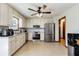 Bright kitchen with stainless steel appliances, white cabinets and subway tile backsplash, and tile floors at 319 Hill Crest Cir, Woodstock, GA 30188