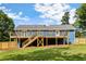 A beautifully renovated home featuring a spacious back deck and fenced yard at 319 Hill Crest Cir, Woodstock, GA 30188