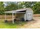 Backyard shows convenient shed and equipment storage on property with a wooden fence at 319 Hill Crest Cir, Woodstock, GA 30188