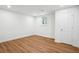 Bedroom featuring hard wood floors, a door and a large window letting in lots of light at 3455 Broxton Mill Way, Snellville, GA 30039