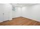 Bedroom featuring hard wood floors, a door to the left and a large window letting in lots of light at 3455 Broxton Mill Way, Snellville, GA 30039