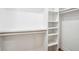 Well-organized walk-in closet with ample shelving and hanging space for clothes and accessories at 3455 Broxton Mill Way, Snellville, GA 30039