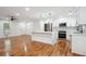 Modern kitchen with white cabinetry, stainless steel appliances, and a large island perfect for entertaining at 3455 Broxton Mill Way, Snellville, GA 30039