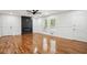 Bright living room with a modern fireplace, hardwood floors, and ample natural light at 3455 Broxton Mill Way, Snellville, GA 30039