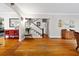 Open-concept living space with hardwood floors and staircase at 64 Edwin Nw, Atlanta, GA 30318