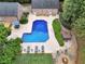 Stunning aerial view of pool, hot tub, lounge chairs, and outdoor fire pit at 704 Branchview Ct, Mcdonough, GA 30252
