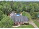 A stunning aerial shot of a home, highlighting the pool, landscaping, and extensive outdoor space at 704 Branchview Ct, Mcdonough, GA 30252