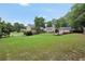 Large backyard featuring a patio and fire pit with lush green grass at 704 Branchview Ct, Mcdonough, GA 30252