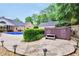 A serene backyard featuring a private hot tub, offering the perfect spot for relaxation and outdoor living at 704 Branchview Ct, Mcdonough, GA 30252