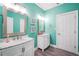 Bright bathroom featuring dual sinks, elegant mirrors, and a modern aesthetic at 704 Branchview Ct, Mcdonough, GA 30252