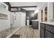 Modern bathroom with a walk-in shower, and vanities, and an adjacent doorway at 704 Branchview Ct, Mcdonough, GA 30252