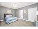 Neutral bedroom with ceiling fan, gray walls and carpet at 704 Branchview Ct, Mcdonough, GA 30252
