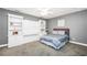 Cozy bedroom features gray walls, carpet, and integrated shelving with window seat at 704 Branchview Ct, Mcdonough, GA 30252