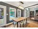 Open-concept dining room with a view of the pool, the backyard, and the living room at 704 Branchview Ct, Mcdonough, GA 30252