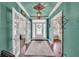 Elegant foyer with beautiful hardwood floors, statement lighting, and a decorative front door at 704 Branchview Ct, Mcdonough, GA 30252
