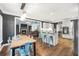 Open concept kitchen and dining area with stainless steel appliances and breakfast bar seating at 704 Branchview Ct, Mcdonough, GA 30252