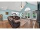 Bright living room with vaulted ceiling, recessed lighting, fireplace and hardwood flooring at 704 Branchview Ct, Mcdonough, GA 30252