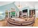 Bright living room features a vaulted ceiling, fireplace, built-in shelves and access to the outdoor patio at 704 Branchview Ct, Mcdonough, GA 30252