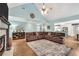 Spacious living room boasts vaulted ceiling, hardwood floors, and open access to kitchen and dining at 704 Branchview Ct, Mcdonough, GA 30252