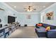Spacious playroom with a cozy couch, stylish decor, and ample storage for toys at 704 Branchview Ct, Mcdonough, GA 30252