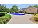 Backyard swimming pool with lounge chairs and patio furniture at 704 Branchview Ct, Mcdonough, GA 30252