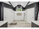 Modern walk-in shower with mosaic stone floor and wall niche at 704 Branchview Ct, Mcdonough, GA 30252