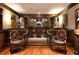 Basement boasts a fully equipped bar area with custom cabinetry and seating for entertaining at 1822 Chartwell Trce, Stone Mountain, GA 30087