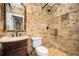 Elegant bathroom featuring decorative tiling, granite countertop vanity, and a glass-enclosed shower with bronze fixtures at 1822 Chartwell Trce, Stone Mountain, GA 30087