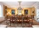 Formal dining room with a long table, chandelier, and elegant decor at 1822 Chartwell Trce, Stone Mountain, GA 30087