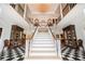 Elegant foyer with soaring ceilings, marble floors, and staircase at 1822 Chartwell Trce, Stone Mountain, GA 30087