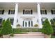 Up close view of a home's front entrance with steps, greenery, and black shutters at 1822 Chartwell Trce, Stone Mountain, GA 30087