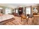 Elegant main bedroom featuring a cozy fireplace, plush seating, and large windows, offering a comfortable and sophisticated retreat at 1822 Chartwell Trce, Stone Mountain, GA 30087