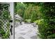 Serene outdoor patio featuring a stone surface, elegant seating, and lush landscaping, creating a peaceful retreat at 1822 Chartwell Trce, Stone Mountain, GA 30087