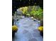 Lush backyard patio boasting decorative stone, lounge chairs, and beautiful landscaping, perfect for outdoor relaxation and entertainment at 1822 Chartwell Trce, Stone Mountain, GA 30087