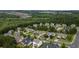 Community aerial showcasing a neighborhood surrounded by lush greenery and mature trees, offering a serene living environment at 3834 Hawk Tail Dr, Loganville, GA 30052