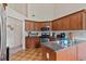 Well-lit kitchen featuring ample cabinet space, modern appliances, and granite countertops at 3834 Hawk Tail Dr, Loganville, GA 30052