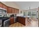Well-equipped kitchen featuring stainless steel appliances and an adjacent dining area with backyard views at 3834 Hawk Tail Dr, Loganville, GA 30052