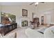 Spacious living room featuring a fireplace, carpet, and views of hardwood floors at 3834 Hawk Tail Dr, Loganville, GA 30052