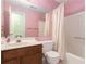 Bathroom features a vanity with a sink, a toilet, and a shower/tub combo at 1908 Brittania Cir, Woodstock, GA 30188