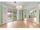 Bright dining area with chandelier and sliding doors that lead to outdoor patio at 1908 Brittania Cir, Woodstock, GA 30188