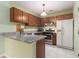 Cozy kitchen featuring granite countertops, stainless steel appliances and bright lighting at 1908 Brittania Cir, Woodstock, GA 30188