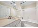 Bathroom features a marble countertop and white tiled shower at 320 Yellowroot Ln, Sandy Springs, GA 30350