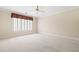 The spacious bedroom has natural light and new neutral carpet at 320 Yellowroot Ln, Sandy Springs, GA 30350