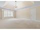 Large bedroom with wall-to-wall carpeting, a ceiling fan, and a window with plantation shutters at 320 Yellowroot Ln, Sandy Springs, GA 30350