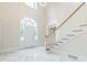 Staircase and entry way, with a marble floor and large entry window at 320 Yellowroot Ln, Sandy Springs, GA 30350