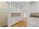 Hallway featuring custom cabinets with granite countertops and an open view to the formal dining room at 320 Yellowroot Ln, Sandy Springs, GA 30350