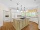 Spacious kitchen featuring a granite island, stainless steel appliances, and hardwood floors at 320 Yellowroot Ln, Sandy Springs, GA 30350