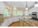 Kitchen with eat-in breakfast nook, granite countertops, and modern appliances at 320 Yellowroot Ln, Sandy Springs, GA 30350