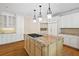 Spacious kitchen with a center island, stainless steel appliances, and ample cabinet space at 320 Yellowroot Ln, Sandy Springs, GA 30350