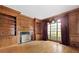 Living room with custom wood trim, a fireplace, hardwood floors, and large windows at 320 Yellowroot Ln, Sandy Springs, GA 30350